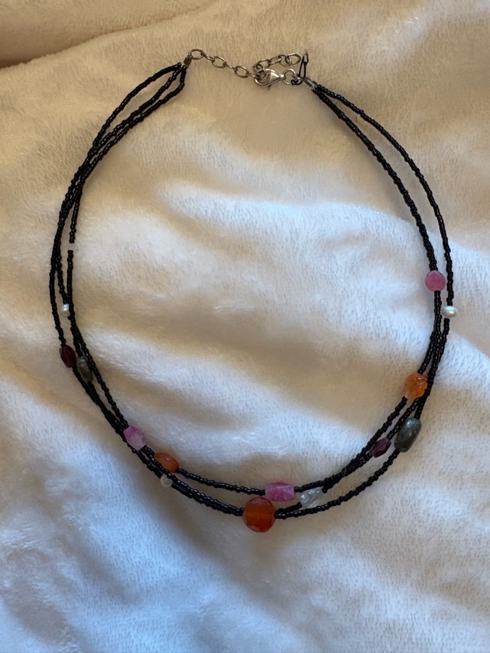 Multi-Strand Black Beaded Necklace with Pink and Orange Accent Stones